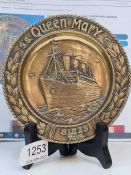 A bronze pin dish decorated SS Queen Mary with registered number to reverse