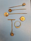 A mixed lot to include two 15ct yellow gold stick pins, small yellow metal locket inset with hair, a