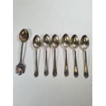 A set of six silver teaspoons by Walker and Hall, hallmarked Sheffield 1932 with another silver teas