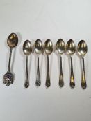 A set of six silver teaspoons by Walker and Hall, hallmarked Sheffield 1932 with another silver teas