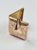 9ct yellow gold locket of rectangular form with engraved floral detail and plain cartouche marked 37