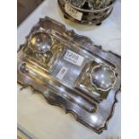 A Barker Brothers Edwardian silver ink stand having decorative border, and two silver topped glass i