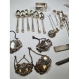 A silver lot comprising of decanter labels, a set of 6 rat tail teaspoons hallmarked Sheffield 1921