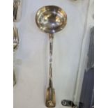 A large Georgian silver ladle having decorative embossed shell details terminating at the handle. Ha