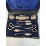 A cased silver manicure set by William Devenport, Birmingham 1918 - 1919. A nice lot