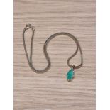 14K yellow gold herringbone design neck chain, hung with a marquise shaped pendant aet with jade, ma