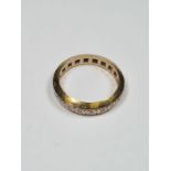 18ct yellow gold eternity ring inset with small diamonds, marked 18ct, size L, approx 3.88g