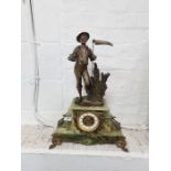 A late 19th/early 20th century onyx mantel clock having gilt metal mounts with Spelter figure of far