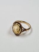 9ct yellow gold dress ring set with oval faceted Citrine with twisted frame on split shoulder suppor