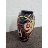Moorcroft; a large vase decorated fruits including peach and fig