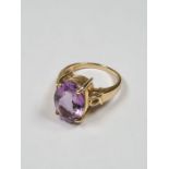 9ct yellow gold dress ring set with large oval mixed cut amethyst in 4 claw mount decorative heart s