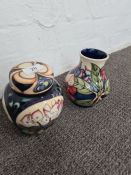 Moorcroft; a ginger jar by Emma Bossoms limited edition of 197/200, dated 2004 and a Moorcroft vase