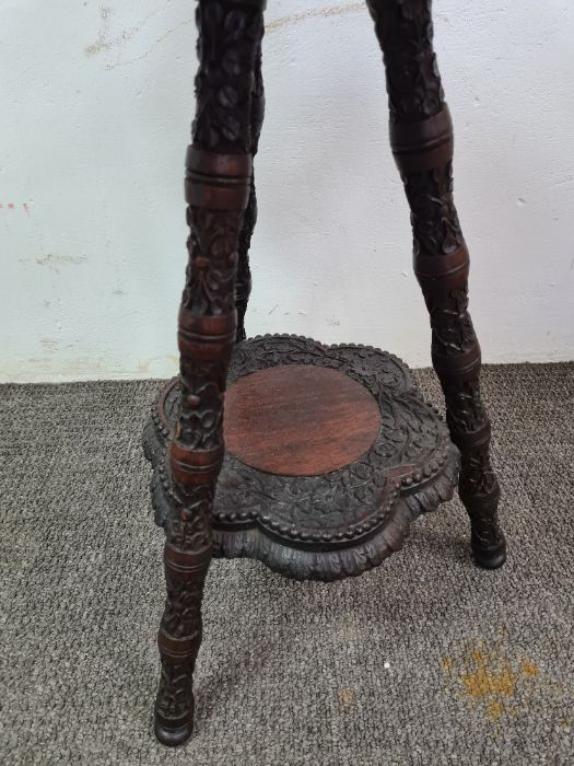 Burmese carved two tier occasional table having shaped top - Image 3 of 3