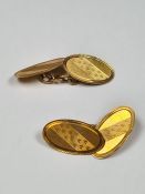 Pair 18ct yellow gold cufflinks of oval shape with machined decoration, marked 18, maker HG & S, app