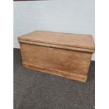 An old stripped pine blanket box