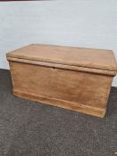 An old stripped pine blanket box