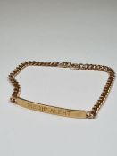 9ct yellow gold medical bracelet with panel inscribed 'Medic Alert', 'Allergic to Penicillin' to rev