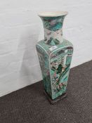 A 19th century Chinese four sided vase decorated figures and animals (damage to top and base)