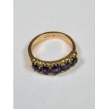 18ct yellow gold dress ring set with 5 graduating amethyst, oval cut, size N, approx 6.03g