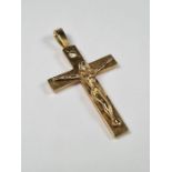 9ct yellow gold large crucifix pendant with single starburst set diamond, 5cm x 3cm, 10.58g approx