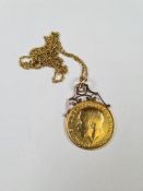 9ct yellow gold fine ropetwist necklace hung with a 1911 Full Sovereign suspended pendant, George V