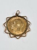 9ct gold mounted pendant encasing a 22ct gold half Sovereign dated 1911 George V and George and The