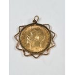 9ct gold mounted pendant encasing a 22ct gold half Sovereign dated 1911 George V and George and The