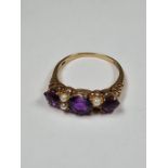 9ct yellow gold dress ring with 3 large round cut amethyst and seed pearls, AF, one missing, approx