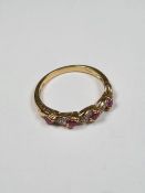 9ct yellow gold ruby and diamond chip cross over design ring, size P, marked 375, approx 2g