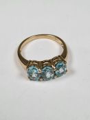 9ct yellow gold trilogy ring set 3 oval cut faceted blue gemstones, marked 375, size O, approx 3.5g