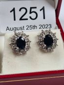 19ct white gold sapphire and diamond cluster earrings, with central oval cut sapphire approx 1.34 ca