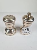 A silver salt and pepper stamped Tiffany and Co., Sterling. Also stamped Italy, Pampaloni Ermindo di