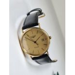 Longines; an 18ct gold cased Longines quartz wristwatch with sate aperture, gold dial and baton mark