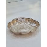 A highly decorative silver Victorian embossed trinket dish by William Comyns and Sons. Appears to be
