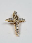 18ct yellow gold diamond inset cross pendant with central crossover design inset graduated round cut