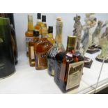 Four bottles of Famous Grouse Scotch Whiskey and 5 other bottles of alcohol