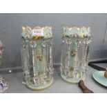 A pair of Victorian pale blue Opaline lustres having floral, painted decoration with clear glass dro