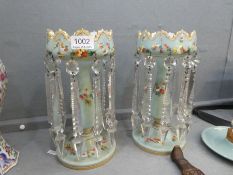 A pair of Victorian pale blue Opaline lustres having floral, painted decoration with clear glass dro