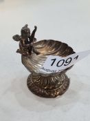 A pretty and decorative silver trinket dish of an Angel seated on a shell. Having a raised pedestal