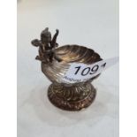 A pretty and decorative silver trinket dish of an Angel seated on a shell. Having a raised pedestal