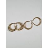 Two pairs of 9ct gold hoop earrings, both marked 375, the largest approx 2.5cm 6.11g approx