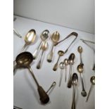 A quantity of silver flatware comprising of mostly Victorian and Georgian pieces to include a pair o