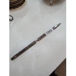 A silver handled letter opener having moving date calendar on the handle. Hallmarked with the London