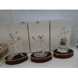A Swarovski Collector's Society figure of Harlequin on oval stand, a Swarowski dancing Clown and one