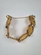 Very pretty 9ct yellow gold bracelet comprising circular floral decorated panels each mounting a Geo