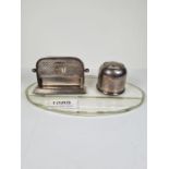 A silver mounted glass combination desk calendar, inkwell. The inkwell having decorative sliding lid