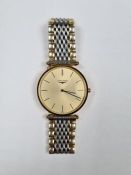 Longines; a Longines La Grande Classique gold plated circular cased wristwatch with stainless steel
