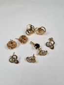 Three pairs of 9ct gold earrings including a knot design pair and a 9ct gold pendant inset circular