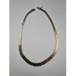 9ct yellow gold three tone fringed Cleopatra style necklace, marked 375, maker GS, 43cm, approx 35.4