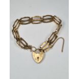 9ct yellow gold 3 bar gate link bracelet, with safety chain and heart shaped clasp 375, London maker